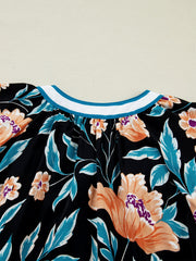 Black floral print blouse with bubble sleeves and a contrast collar.