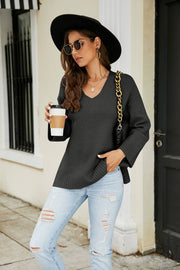 Black relaxed fit v-neck knit pullover sweater with ribbed cuffs and hem.