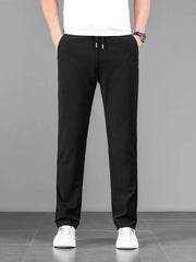 Black casual drawstring sweatpants with pockets and a relaxed fit.
