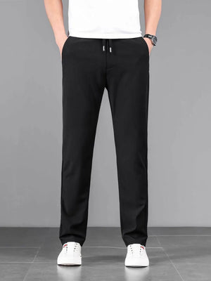 Black casual drawstring sweatpants with pockets and a relaxed fit.