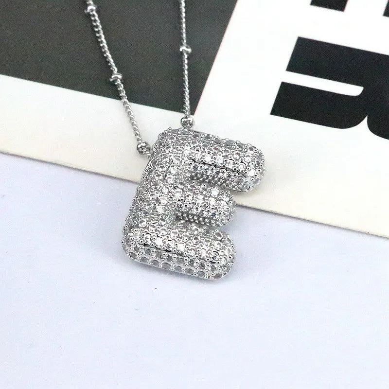 Silver initial E bubble pendant necklace with pave crystals