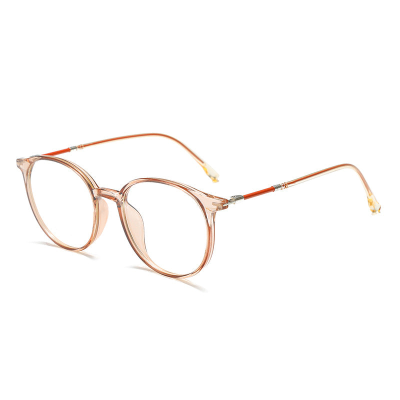 Round acetate eyeglasses with clear lenses and metal temples in a light brown hue.