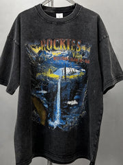 Black vintage wash graphic tee with Rockies mountain and waterfall scene.