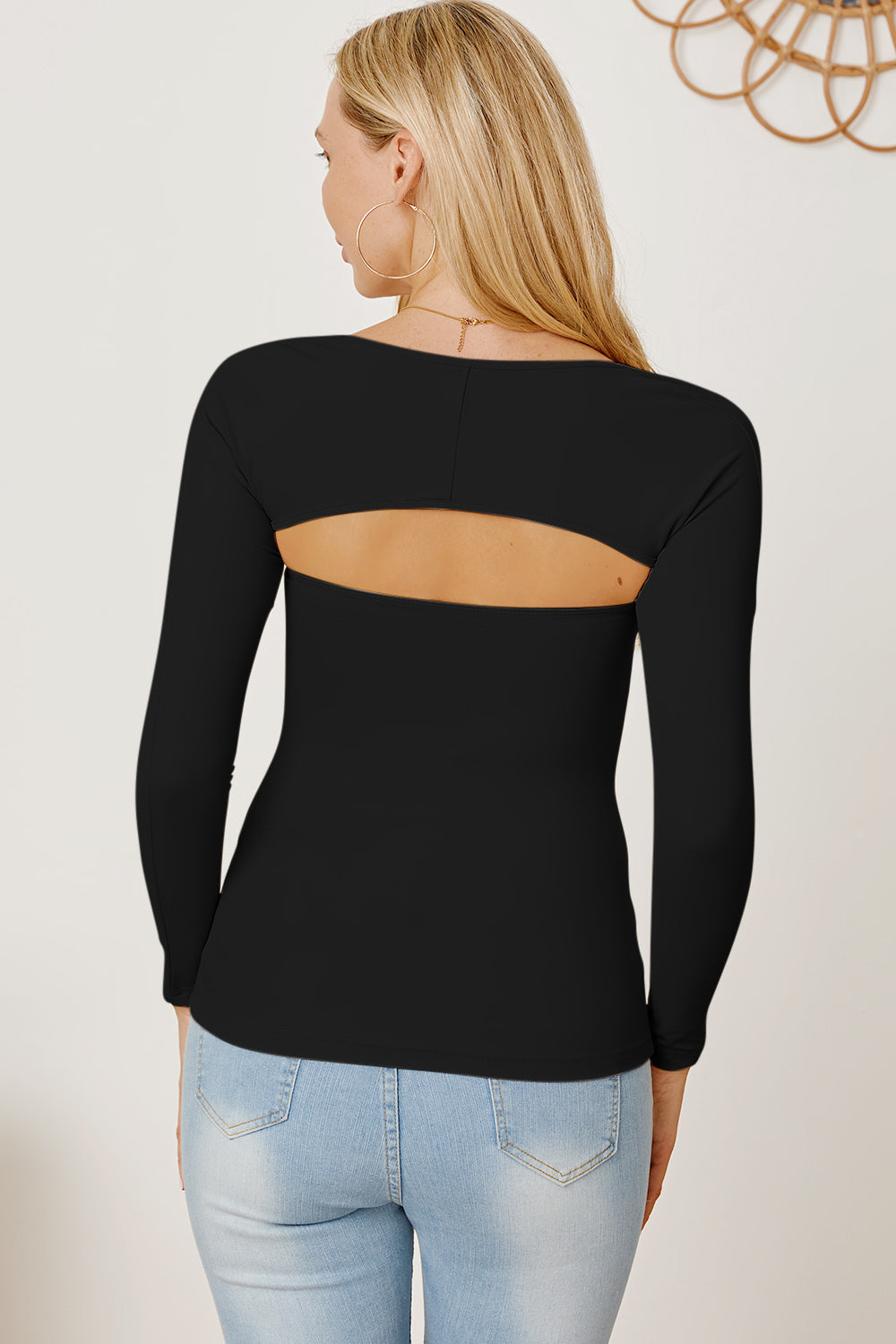 Black long sleeve bodysuit with open back detail