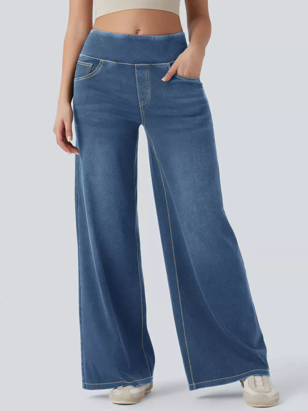 Maternity wide-leg denim jeans in medium dark blue with yellow stitching and pockets.