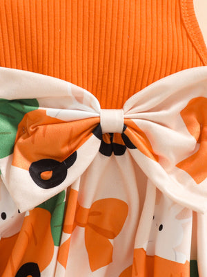 Orange ribbed baby set with bunny and carrot print, featuring a large bow detail.