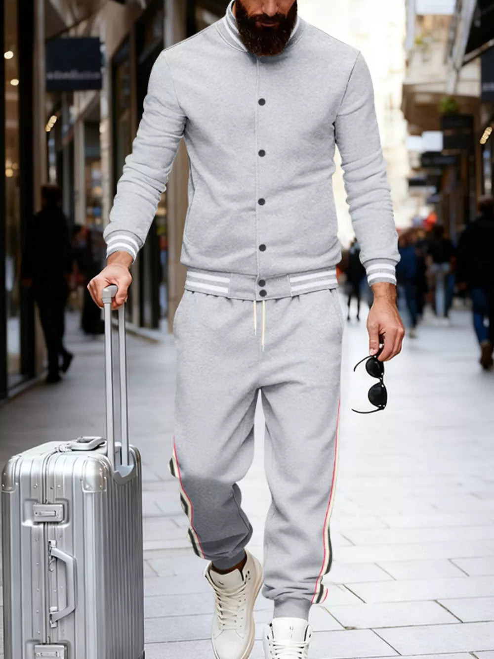 Light gray men's track pants with side stripes and drawstring waist.