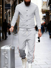 Light gray men's track pants with side stripes and drawstring waist.
