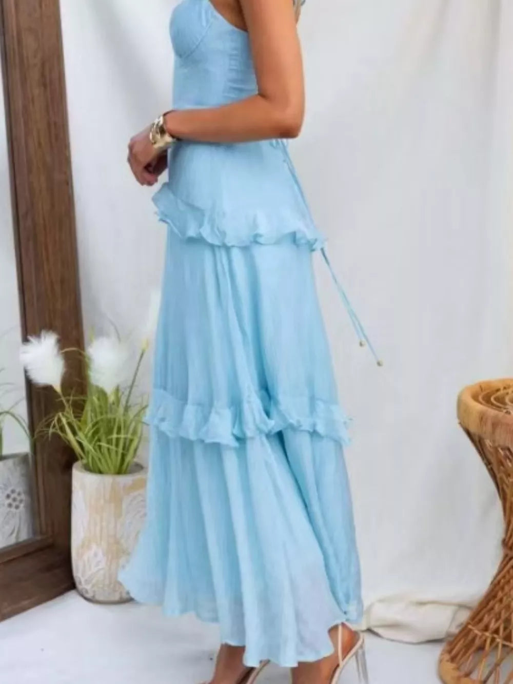 Aqua ruffled maxi dress with lace-up detail and sweetheart neckline.