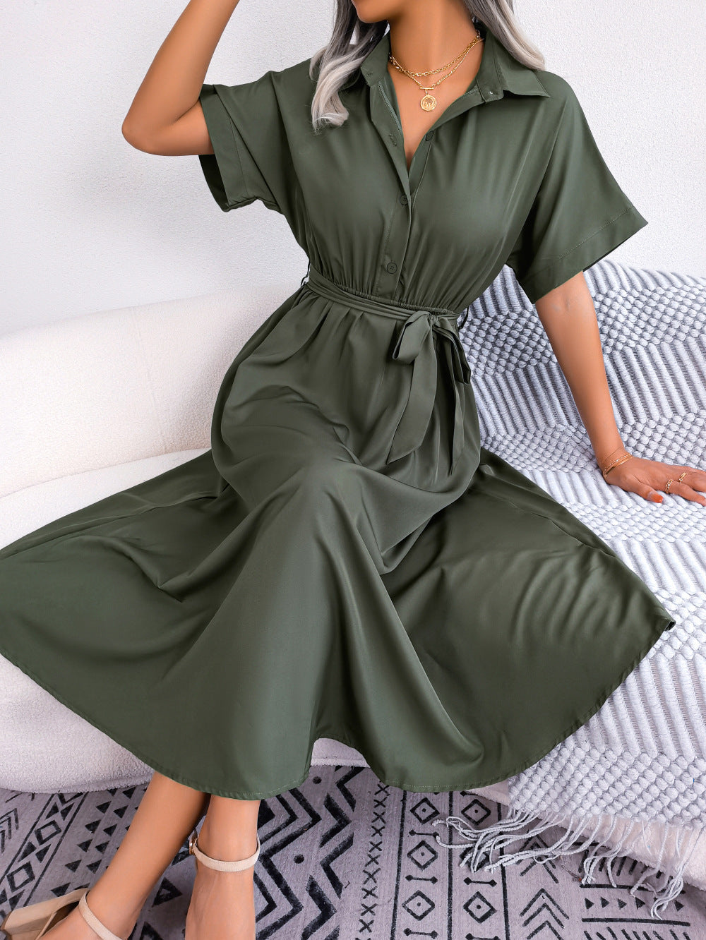 Army green button-down midi dress with short sleeves and a tie belt.