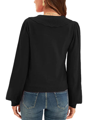 Black knit cardigan with scalloped collar and puff sleeves