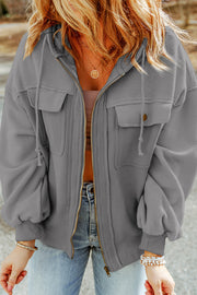 Textured grey utility hoodie jacket with two chest pockets and a zip front.