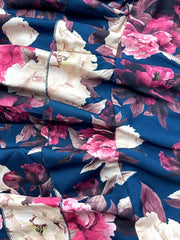 Ruffled floral two-piece set in navy with pink and cream peonies, polyester fabric.