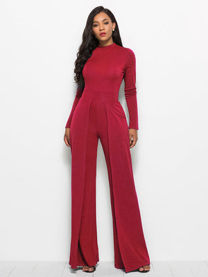 Red high-waisted palazzo jumpsuit with long sleeves and front slit pants.