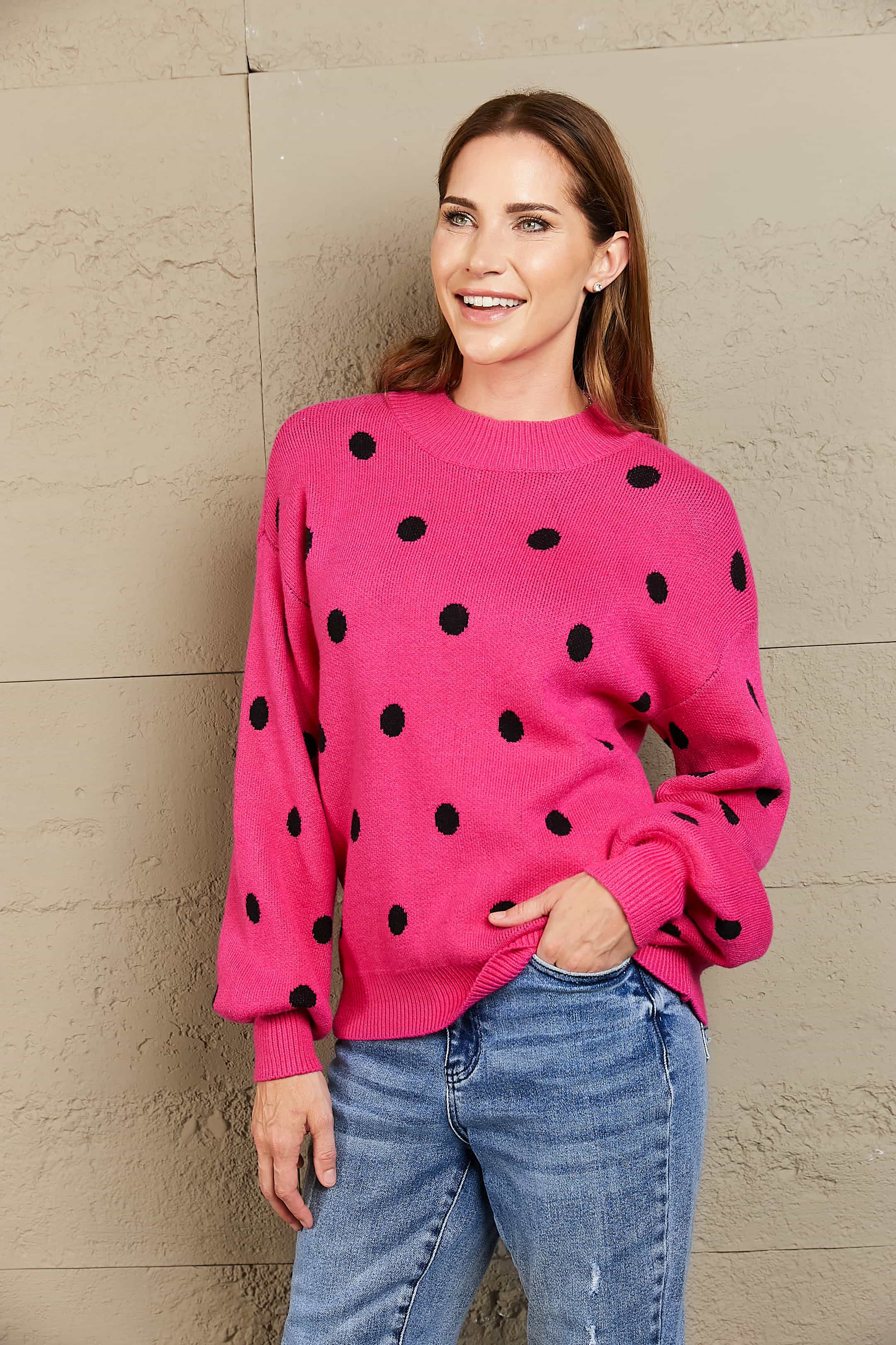 Hot Pink polka dot knit sweater with balloon sleeves and crew neck.