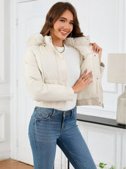 White puffer jacket with faux fur trim and lining, featuring a cropped fit and elasticated cuffs.
