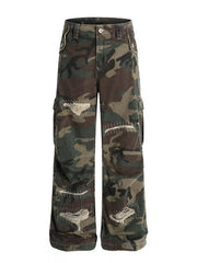 Men's distressed camouflage cargo pants with ripped details and white stitching.