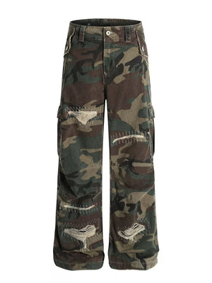 Men's distressed camouflage cargo pants with ripped details and white stitching.