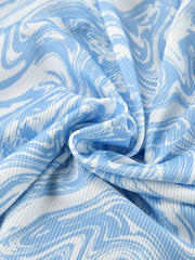 Lace-up two-piece lounge set in blue and white abstract print ribbed fabric.