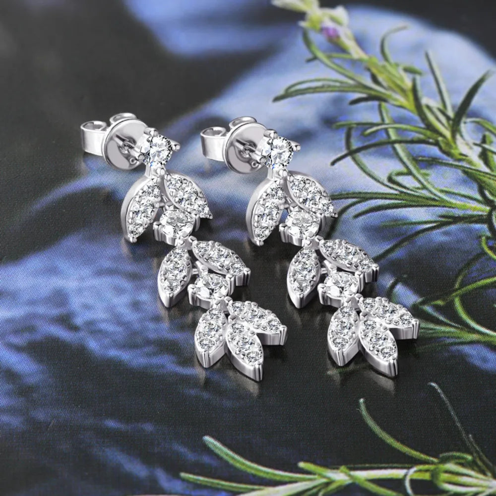 Silver cubic zirconia botanical drop earrings with leaf design