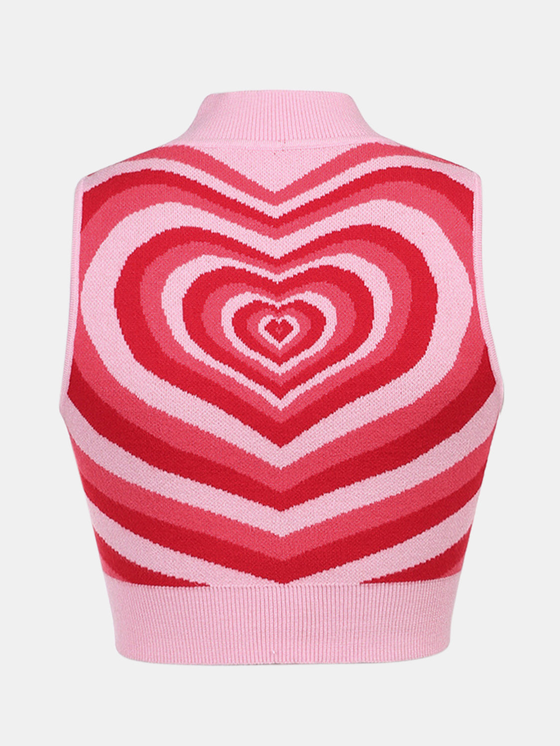 Pink knit tank top with concentric heart intarsia pattern in shades of red and pink.