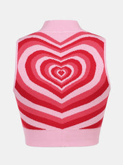 Pink knit tank top with concentric heart intarsia pattern in shades of red and pink.