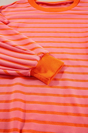 Chevron-Inset Stripe Sweatshirt in pink and orange horizontal stripes with orange cuffs.