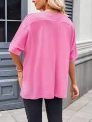 Pink relaxed fit t-shirt with short dolman sleeves and a crew neck.