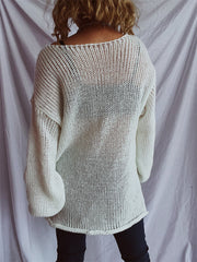 White open-knit slouchy boatneck pullover sweater with wide sleeves.