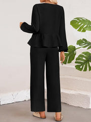 Black textured peplum co-ord set with wide leg pants and long sleeves