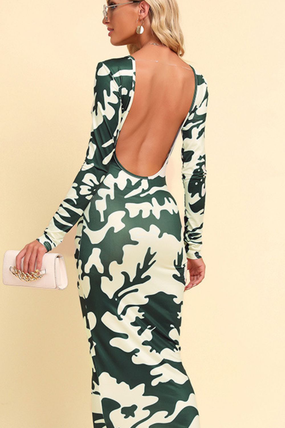 Sculpted camo backless maxi dress with long sleeves in green camouflage pattern.