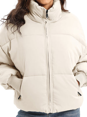 Padded bomber jacket in cream with ribbed cuffs and a high collar.
