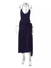 Navy halter neck ruched maxi dress with deep v-neck and tie detail