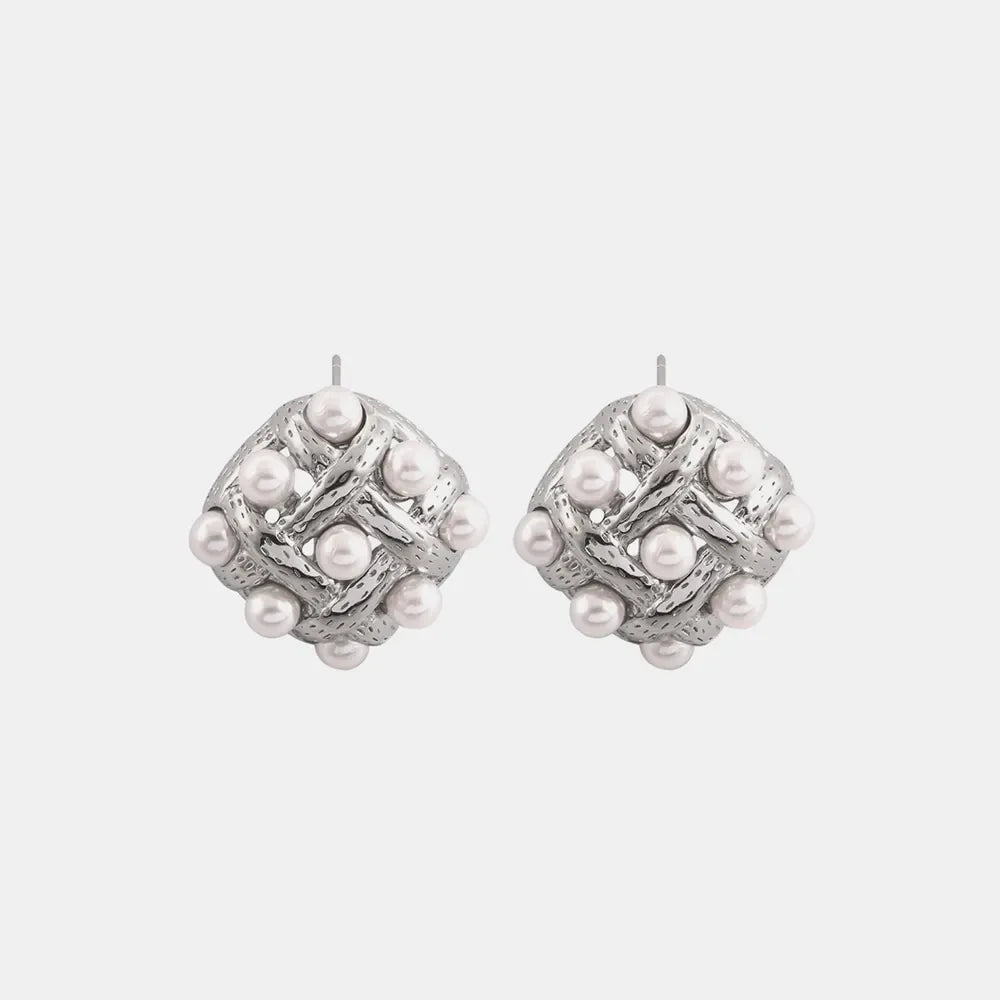 Silver woven pearl grid earrings with a diamond pattern and textured metal detail.