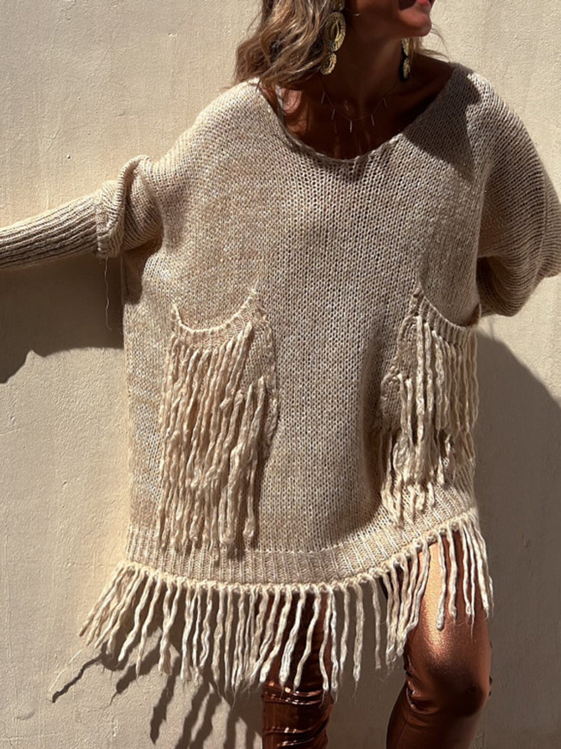 Camel knit poncho sweater with fringe pockets and hem