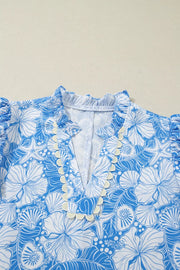 Tropical floral v-neck blouse with frill trim and puff sleeves in blue and white polyester