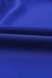 Royal blue jumpsuit fabric detail with subtle texture