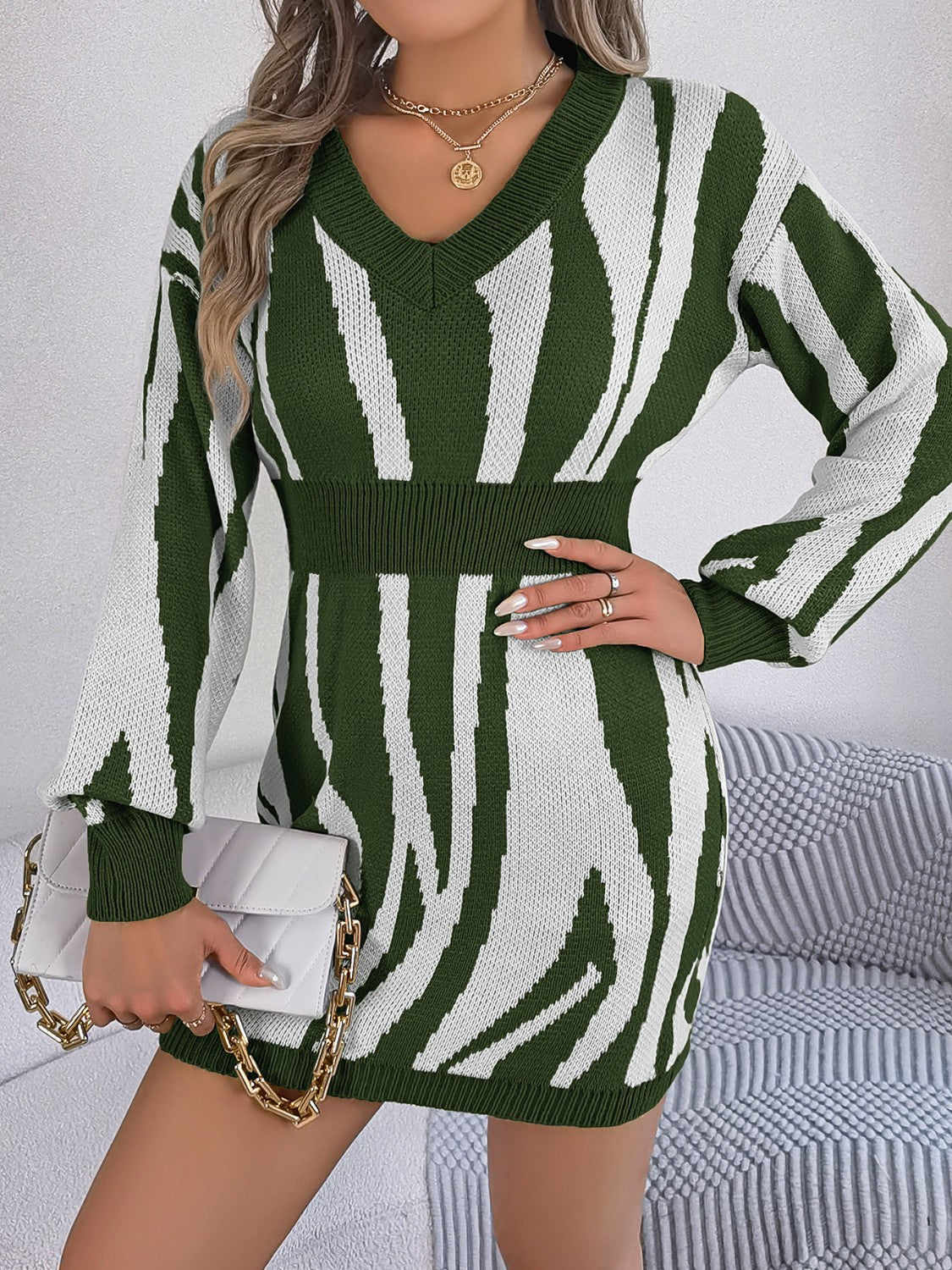 Army green and white zebra stripe knit fit-and-flare dress with V-neck and cinched waist.