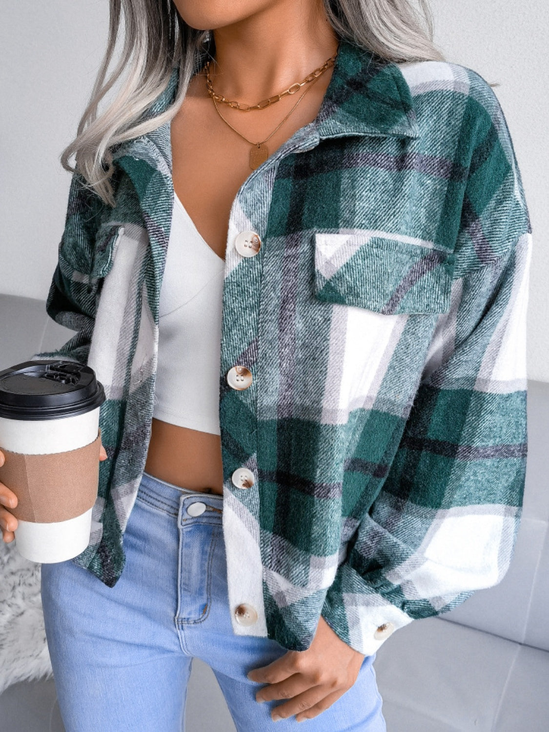 Oversized green tartan shacket with patch pockets and button front.