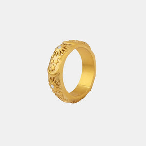 Gold titanium band ring with celestial engraving and small clear stones