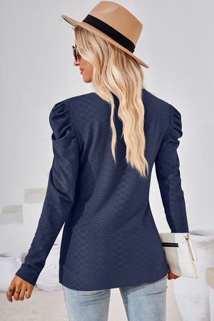 Dark blue textured puff-sleeve crew neck top with diamond pattern