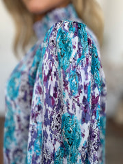 High neck abstract print blouse in sky blue and violet with a flowing silhouette.