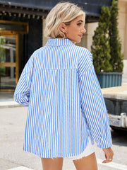 Sky blue and white striped oversized button-up shirt with a tie-front detail.