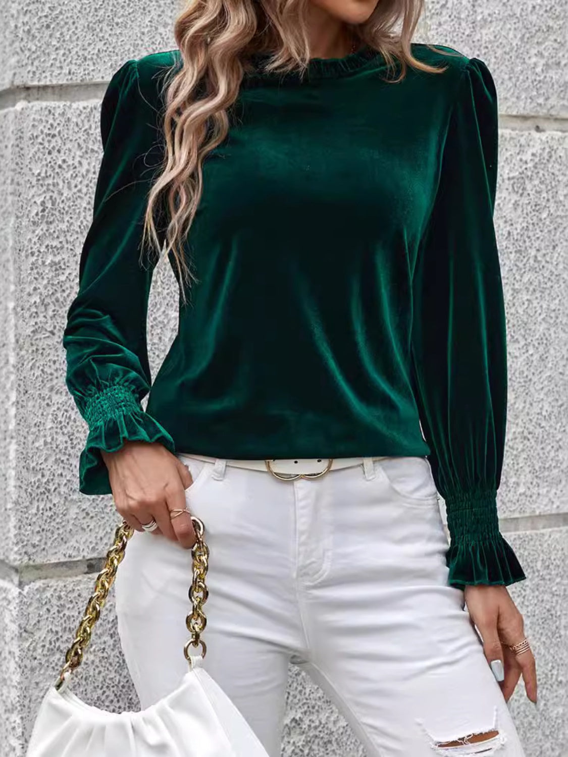 Dark green velvet blouse with blouson sleeves and ruffled cuffs.