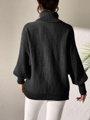 Black turtleneck sweater with balloon sleeves and ribbed cuffs and hem