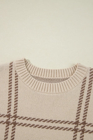 Tan crewneck knit pullover sweater with a brown gridline pattern and ribbed neckline.
