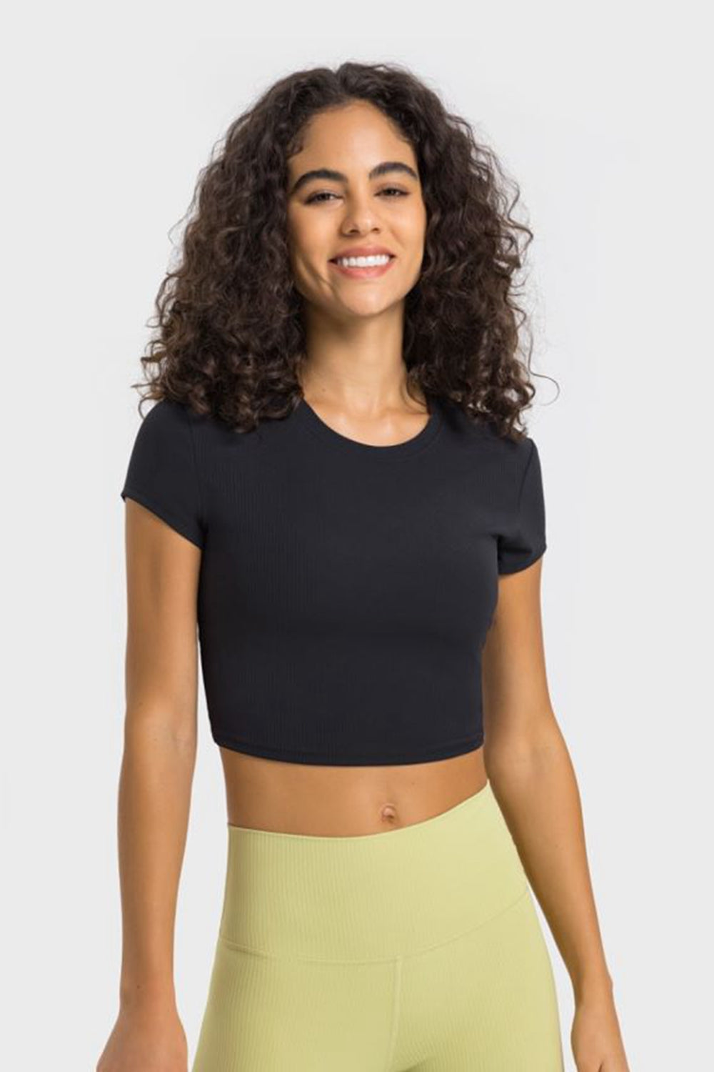 Black ribbed crewneck crop top with short sleeves