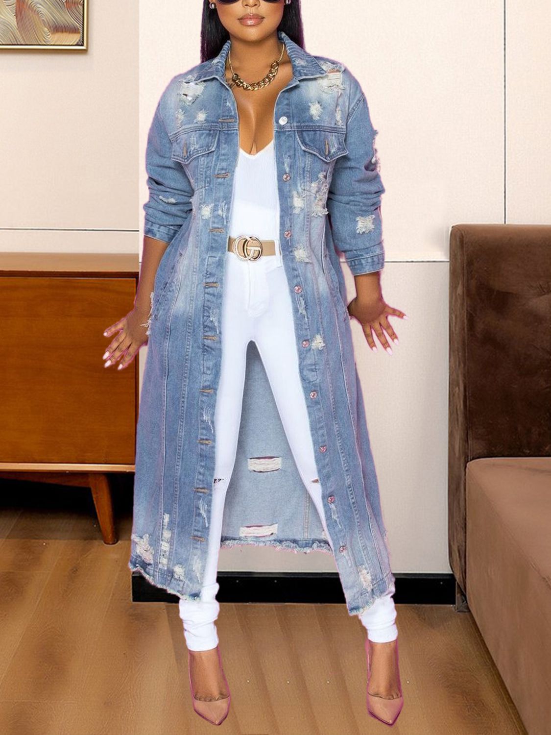 Distressed light wash denim duster coat with button front and long sleeves.