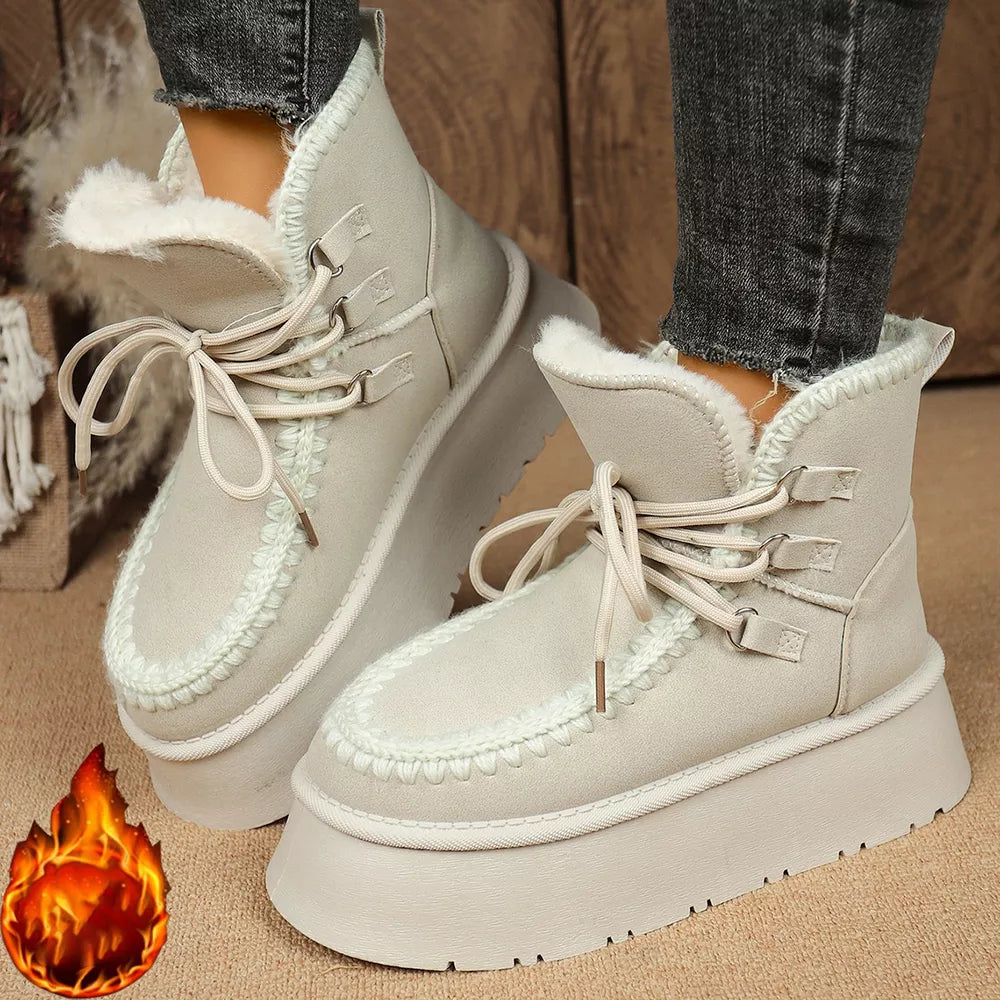 Suede lace-up platform ankle boots with faux fur lining and chunky sole.