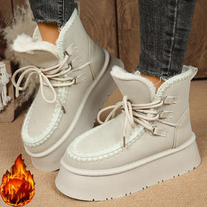 Suede lace-up platform ankle boots with faux fur lining and chunky sole.